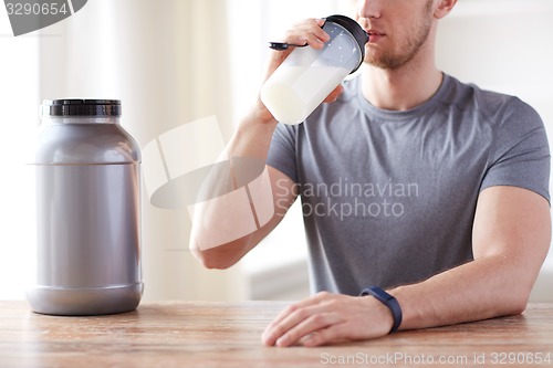 Image of close up of man drinking protein shake