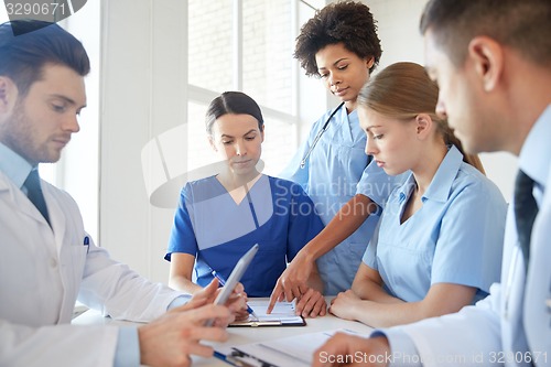 Image of group of doctors meeting at hospital office