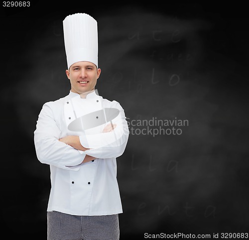 Image of happy male chef cook with crossed hands