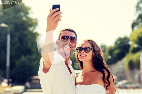 Image of smiling couple in city