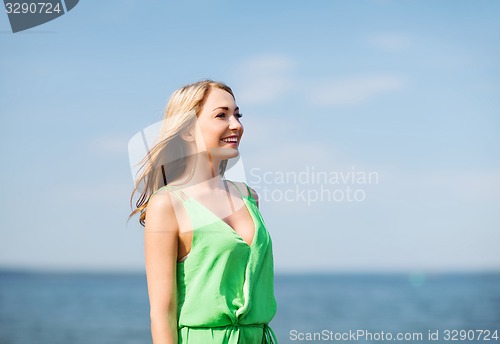 Image of girl standing on the beach