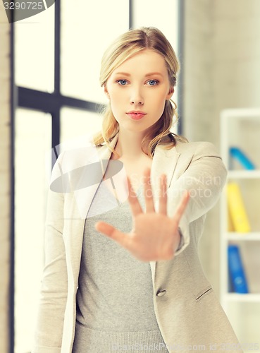 Image of woman making stop gesture