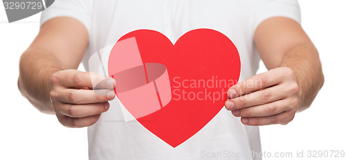 Image of closeup of man hands with heart