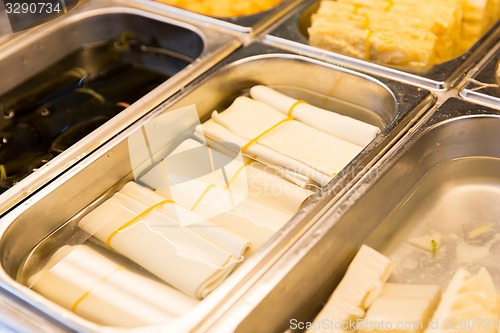 Image of spring rolls and snacks at street market