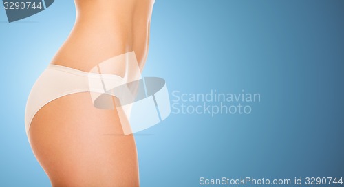 Image of close up of slim woman tummy and hips in underwear