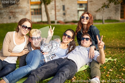 Image of group of happy students showing victory gesture