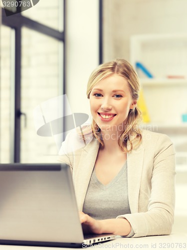 Image of happy woman with laptop computer