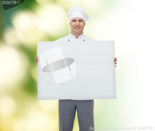 Image of happy male chef cook holding white blank big board