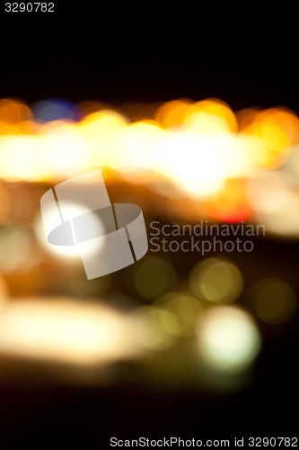 Image of golden bright lights on dark night background