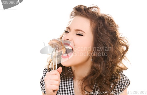 Image of paleo diet concept - woman eating meat