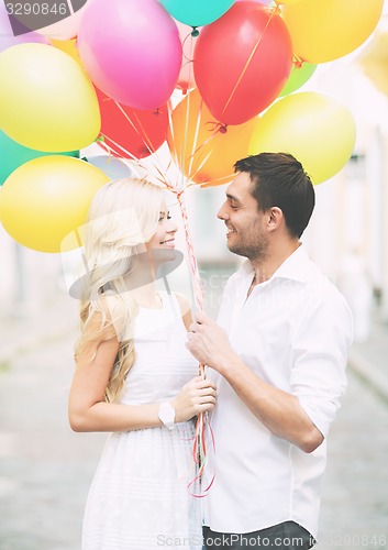 Image of couple with colorful balloons