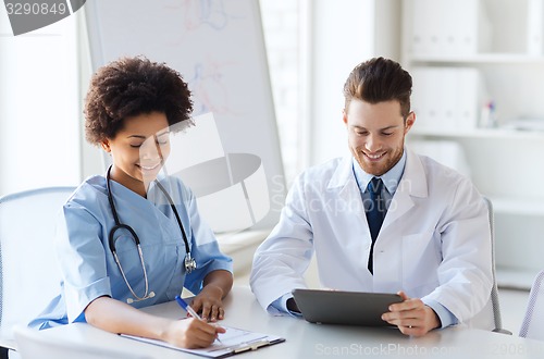 Image of two happy doctors meeting at hospital office