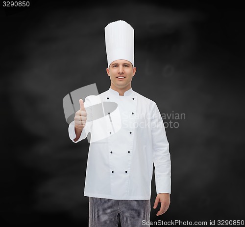 Image of happy male chef cook showing thumbs up