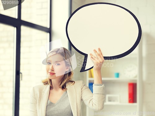 Image of smiling businesswoman with blank text bubble