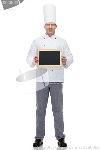 Image of happy male chef cook holding blank menu board