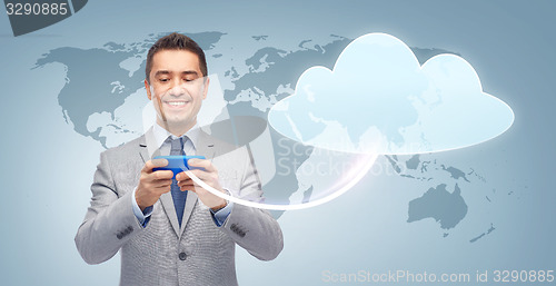 Image of happy businessman texting message on smartphone
