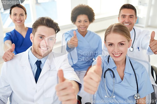 Image of group of happy doctors on seminar at hospital