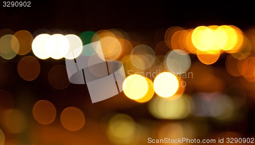 Image of golden bright lights on dark night background