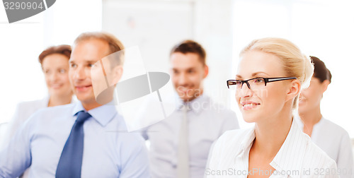 Image of businessmen and businesswomen on conference