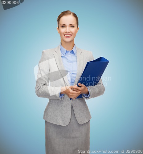 Image of smiling businesswoman holding folder