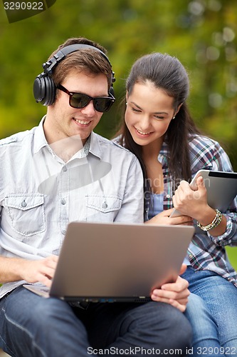 Image of students or teenagers with laptop computers