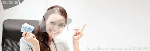 Image of happy woman with computer and euro cash money