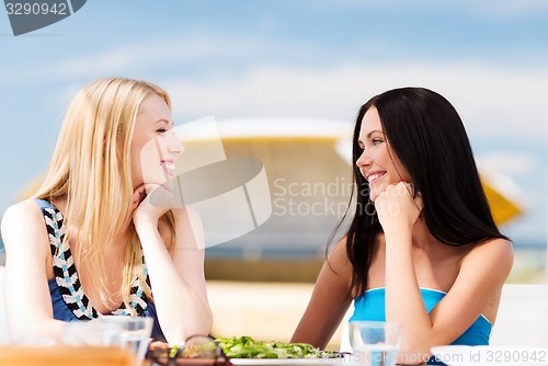 Image of girls in cafe on the beach