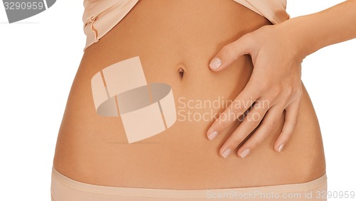 Image of woman with hand on her belly