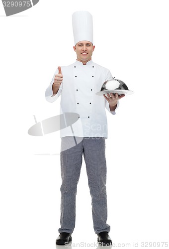 Image of happy male chef cook with cloche showing thumbs up