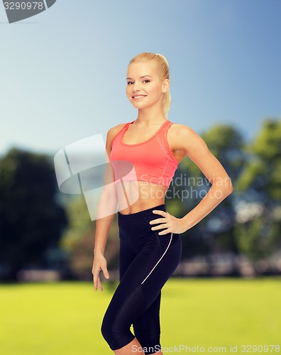 Image of beautiful athletic woman in sportswear