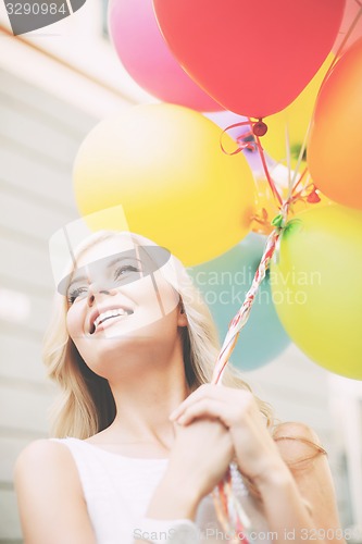 Image of woman with colorful balloons