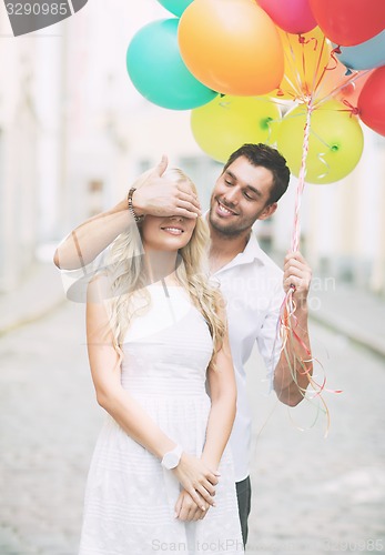 Image of couple with colorful balloons