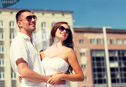 Image of smiling couple in city