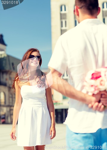 Image of smiling couple in city