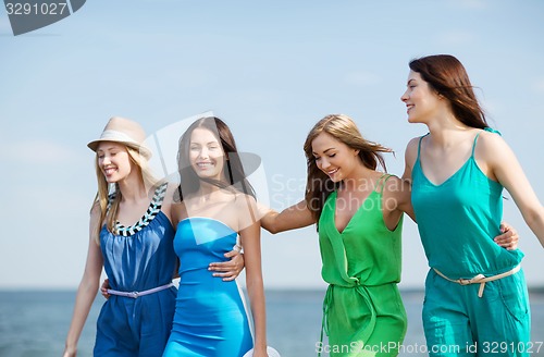 Image of girls walking on the beach