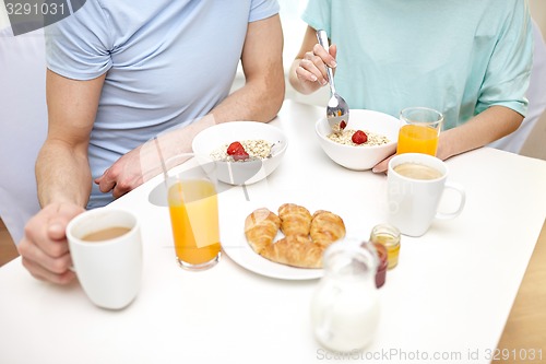 Image of close up of couple having breakfast at home