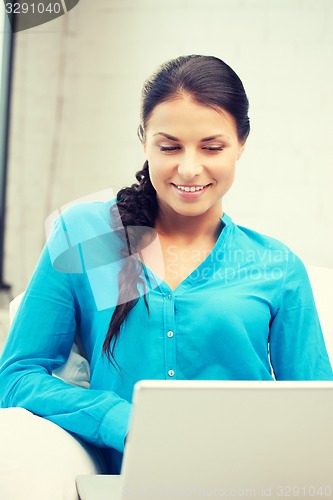 Image of happy woman with laptop computer