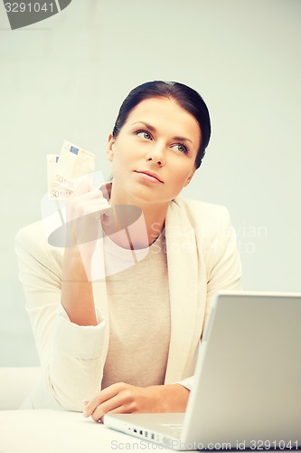 Image of lovely woman with euro cash money