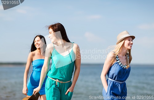 Image of girls walking on the beach