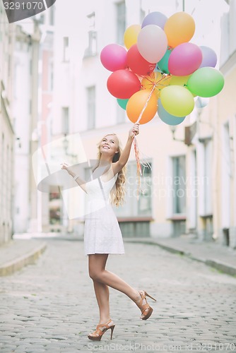 Image of woman with colorful balloons