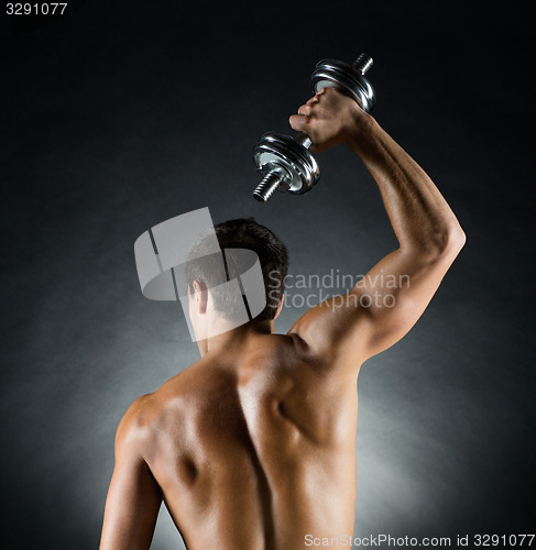 Image of young man with dumbbell