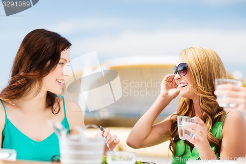 Image of girls in cafe on the beach