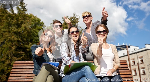 Image of group of students or teenagers showing thumbs up