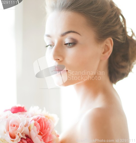 Image of bride with bouquet of flowers