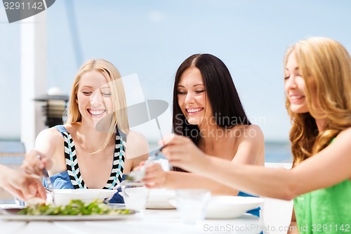 Image of girls in cafe on the beach