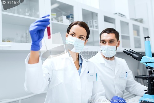 Image of young scientists making test or research in lab