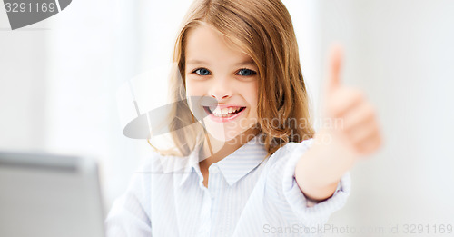 Image of girl with laptop pc at school