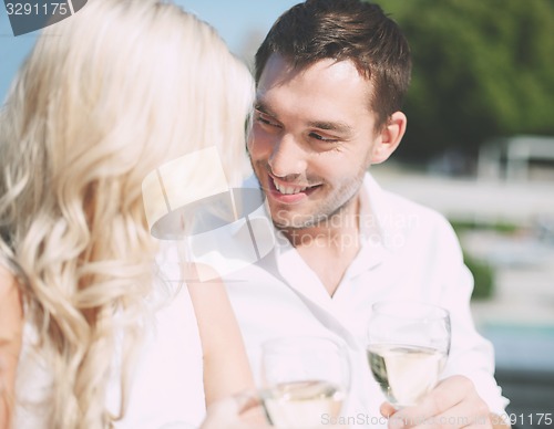 Image of couple drinking wine in cafe