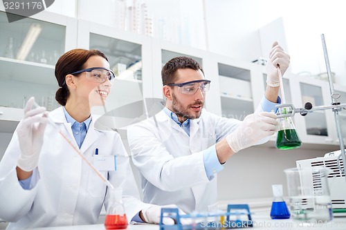 Image of young scientists making test or research in lab