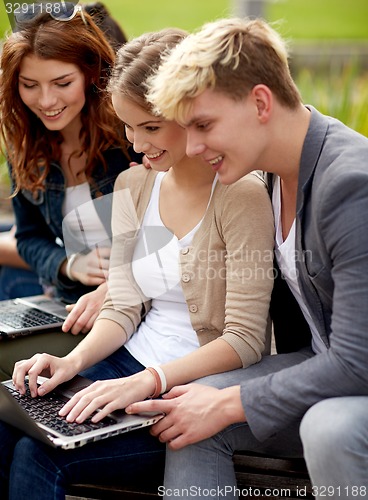 Image of students or teenagers with laptop computers